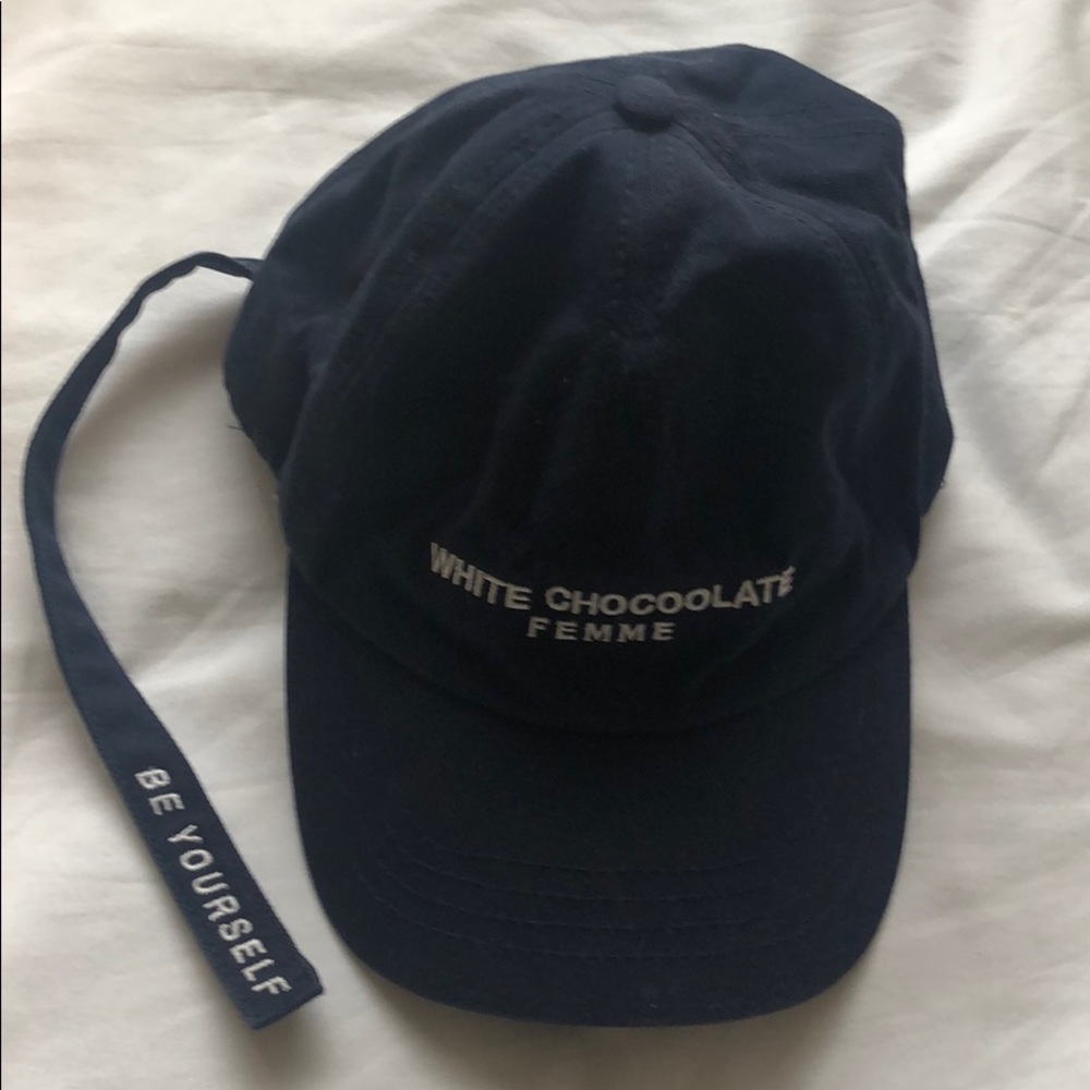 This is a baseball hat in navy with a strip